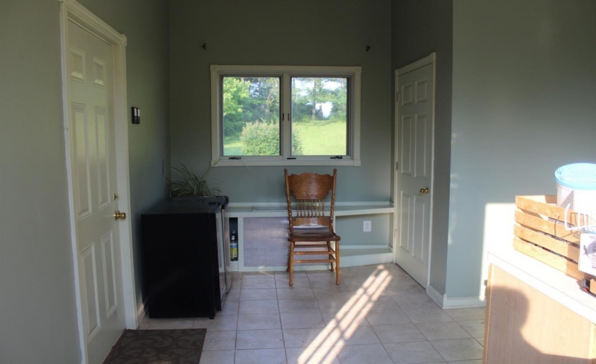 Breezeway with tile floor garage on left