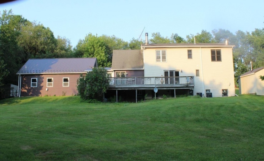 House garage to left and wood furnace to right