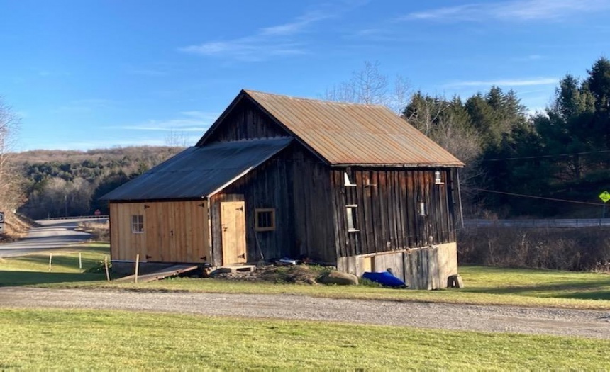 Three story barn with workshop, loft storage and additional storage or room for animals below.