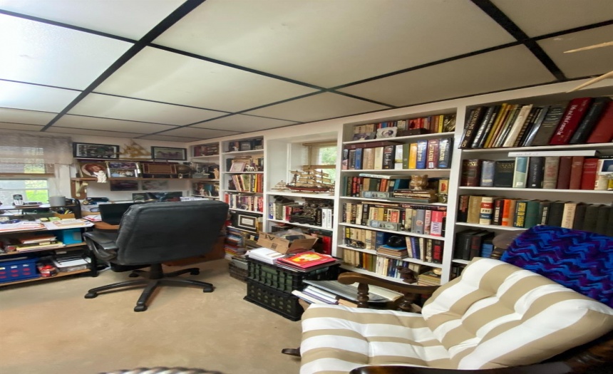 Downstairs bonus room, lots of built in bookshelves. Currently used as an office.