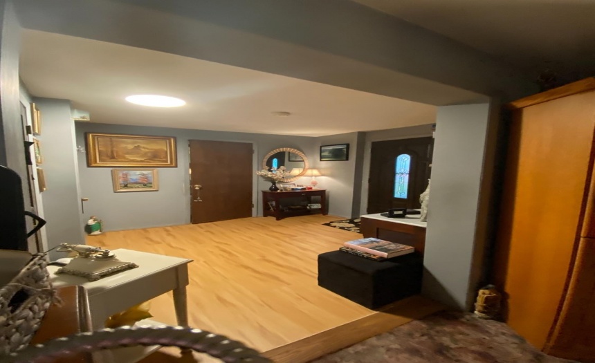 Front foyer, door ahead leading to 2nd downstairs bedroom.