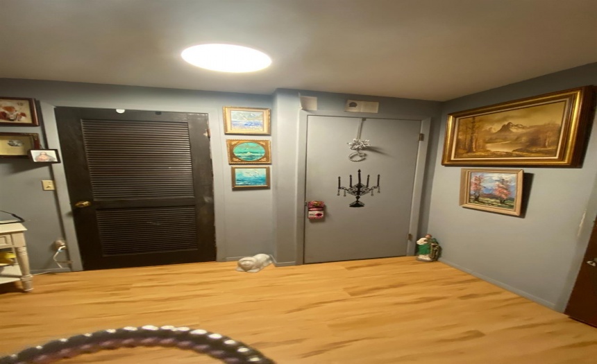 Coat closet on left, door on right leads up to second story living space (apartment or parent suite)