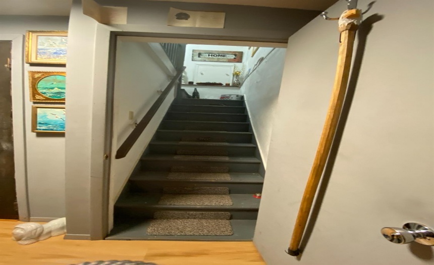 Stairs leading to upstairs apartment.