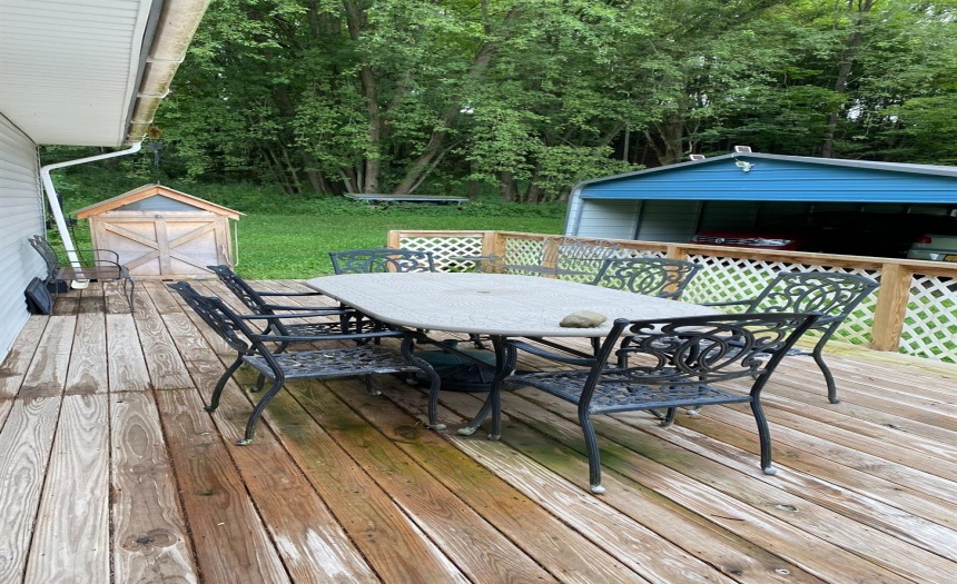 Deck on side of house to access side entrance. Also has a ramp.