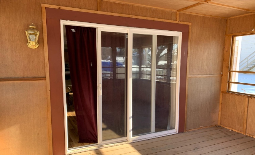 sliding door to dining room from screened in porch