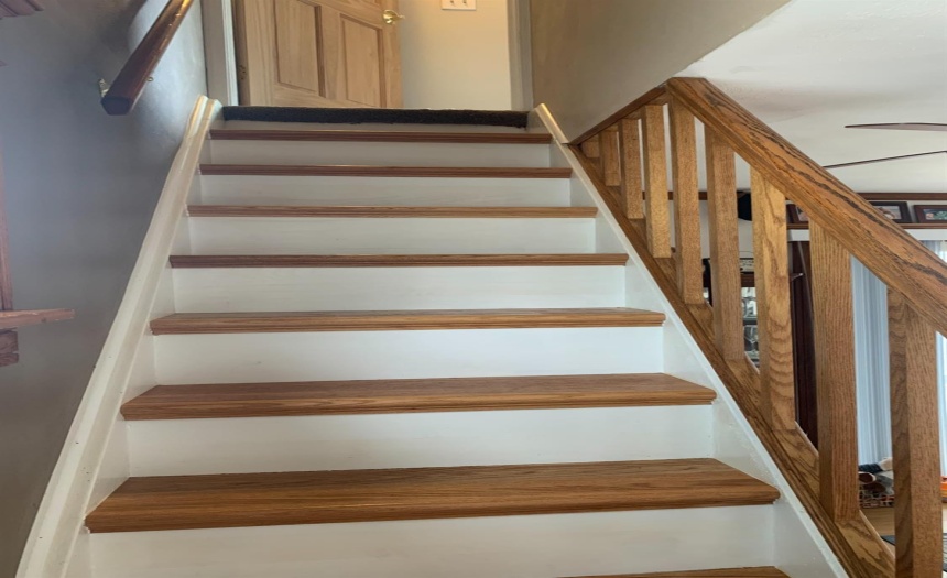 Stairs off the living room go to the master bedroom
