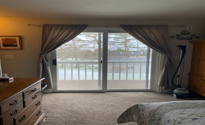 Sliders to balcony in master bedroom