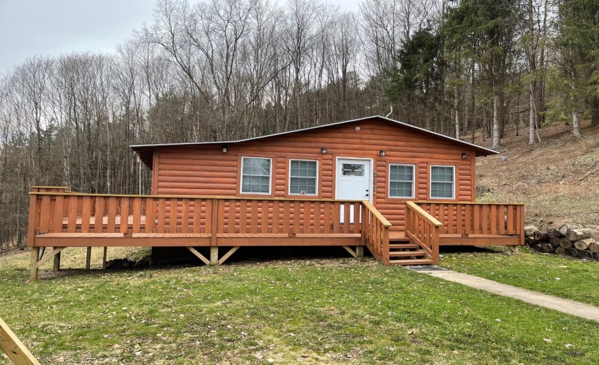Pristine 4 bed 1 bath log cabin camp nestled on the side of a hill just minutes away from Walton, in the very heart of Delaware County.