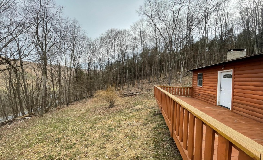 Door by the bedrooms leading out to the wraparound deck that overlooks the lawn and valley