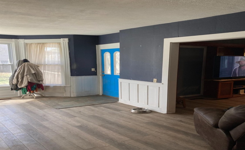 Entry Door into Living Room - Wood Laminate floor.