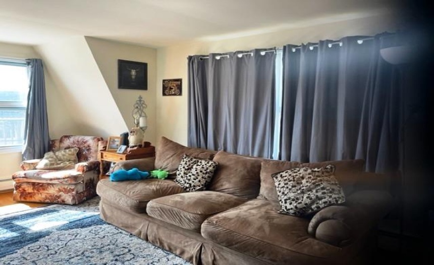 Upstairs large bright 3 bedroom apartment for owner or income