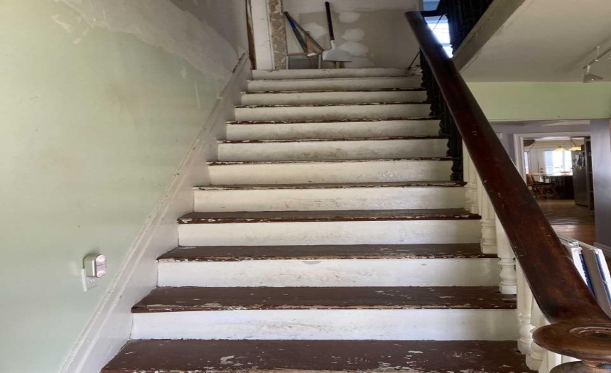 Contractors have been secured to paint staircase prior to closing.