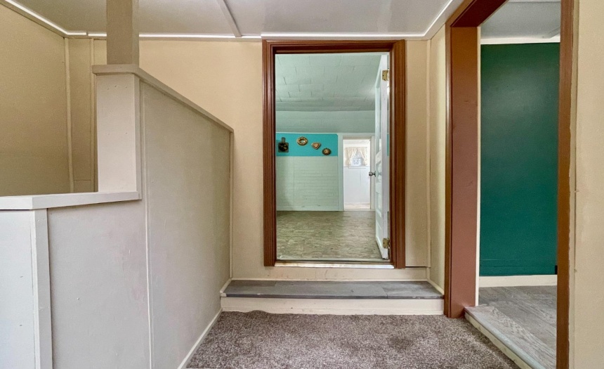 Side entry - basement stairs to the left, mudroom to the right, kitchen straight ahead