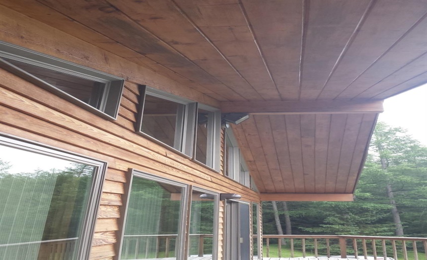 Wooden roofers gives nice finish to ample overhang.