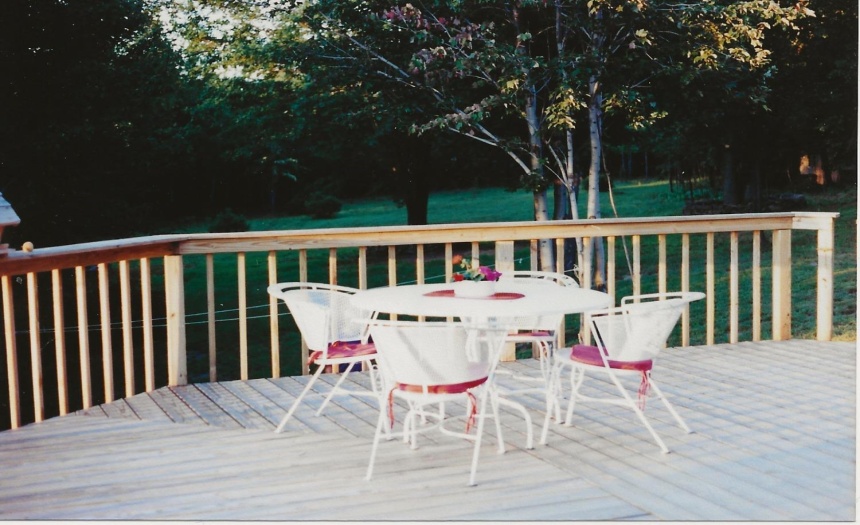 Spacious wrap deck.  Great place for that evening meal or just enjoy breezes, birds and foliage.