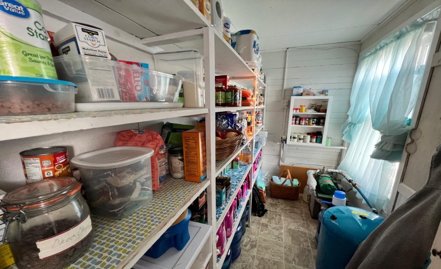 Walk-in pantry just steps away from kitchen.