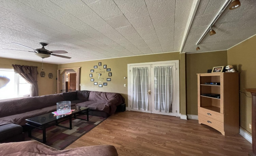 This view in the formal dining room shows the french doors that open into the den and the doorway to the left opens into the kitchen