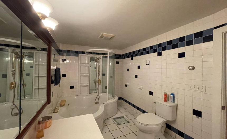 First floor bath is tiled, and features a nice jetted deep bath tub.