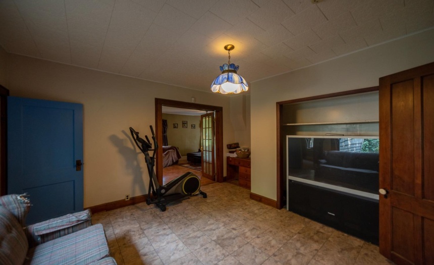 View across the den showing the french doors that lead into the formal living room