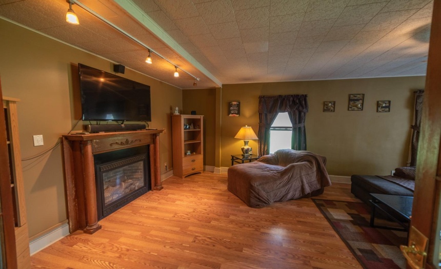 Formal living room with gas fireplace.