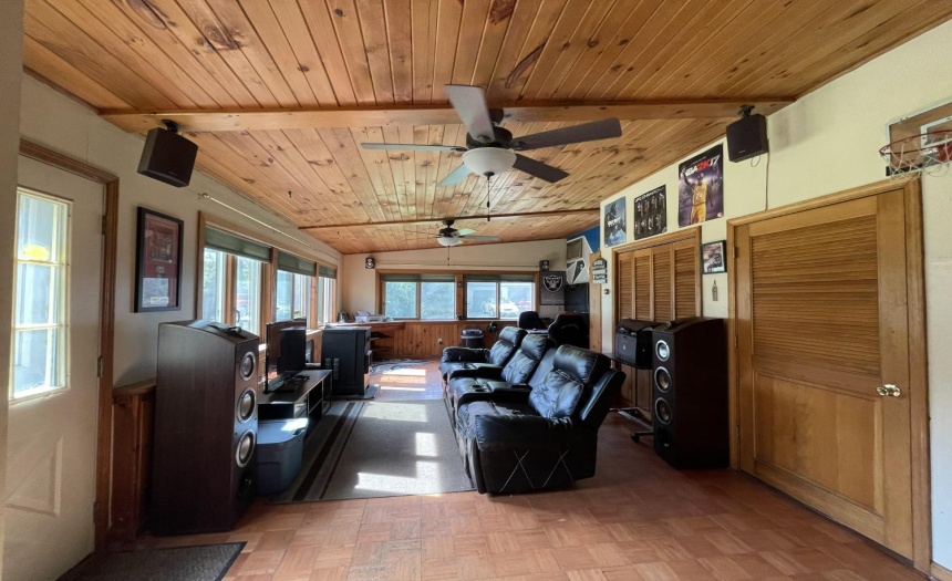 LET THE GAMES BEGIN!  Multi purpose room features outside entrance, expansive closets, knotty pine ceiling, LOTS of NATURAL light.