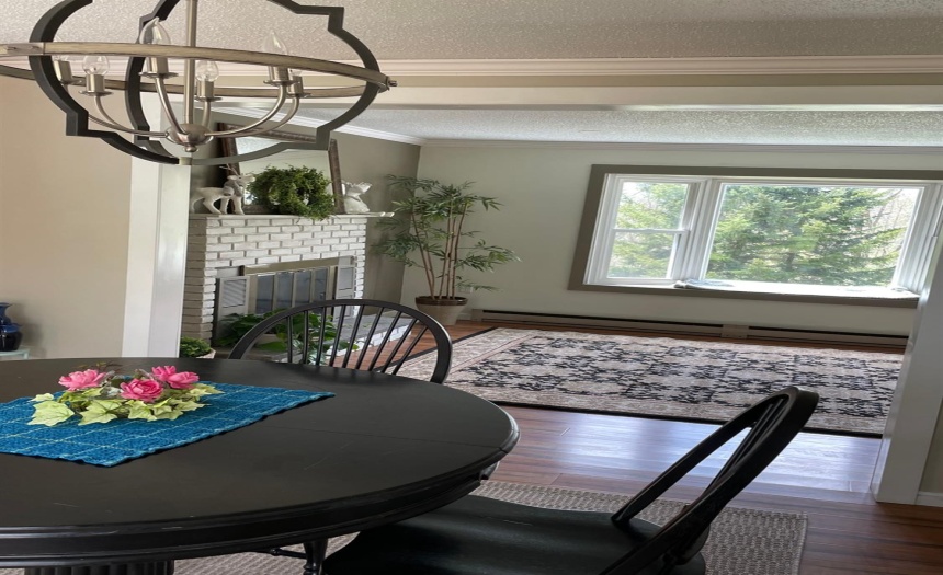 Floor plan flows from kitchen to dining room and living room.