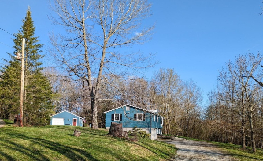 Completely renovated country home with 2 car garage plus detached garage with insulated work shop and shed for all the toys.