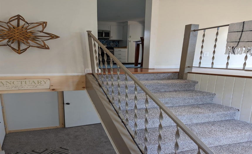 Stairs leading to finished lower level