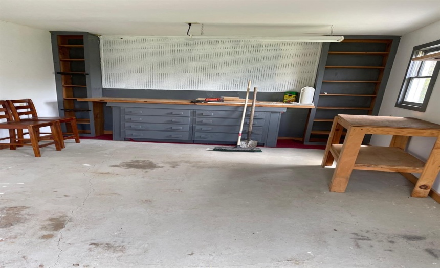 Shop area in detached garage. Could be home office, craft room...What ever best suits your needs