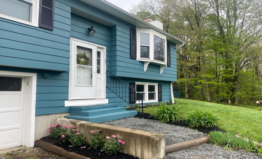 Nice perennials add to the charm of this home in move in condition
