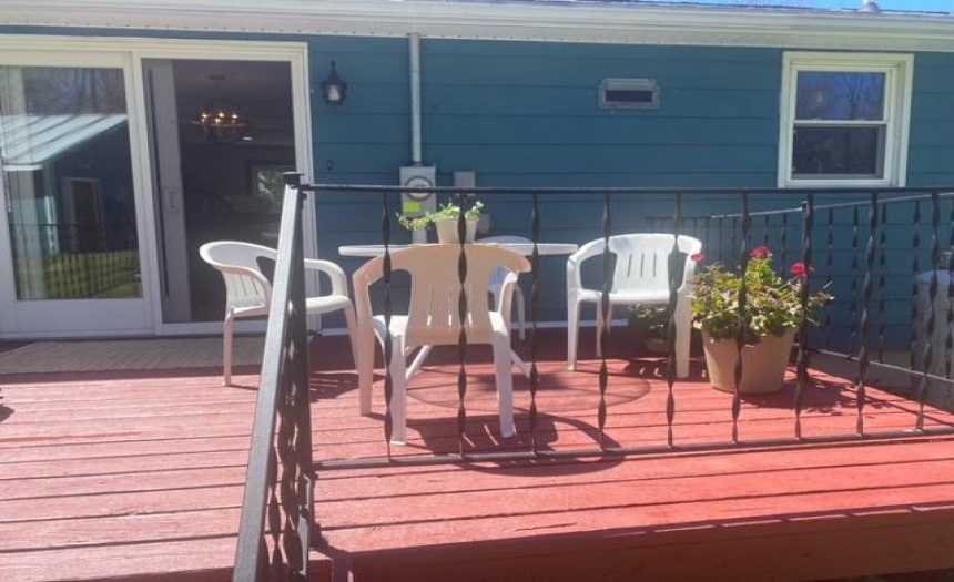 Rear deck opens into dining room. Enjoy morning coffee or evening dinner....