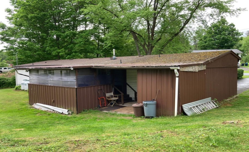 Back of house leading to patio and garage