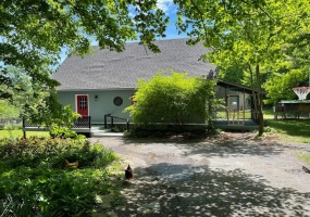 Front with view of the screened-in porch