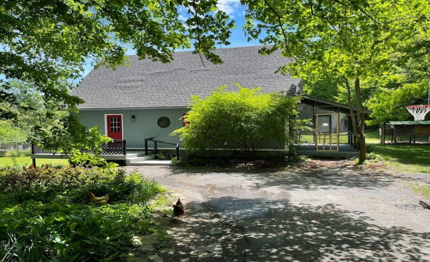 Front with view of the screened-in porch