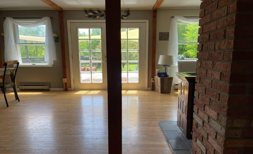 View through French doors that open on to the deck