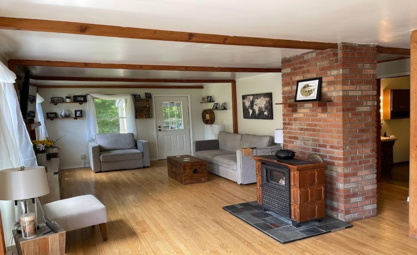 Living room new Hearthstone Castelton soap stone wood stove in shed is being left for the buyers